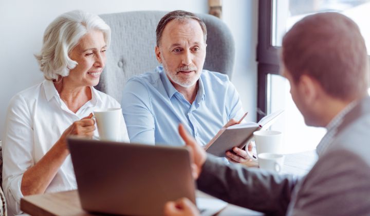 Physical therapist discussing treatment costs with a patient