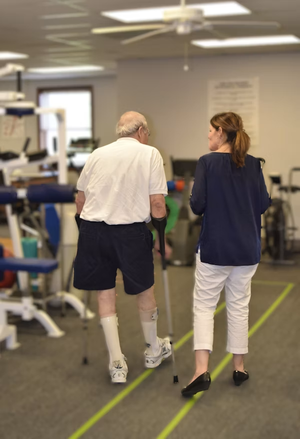 Physical therapist analyzing walking gait
